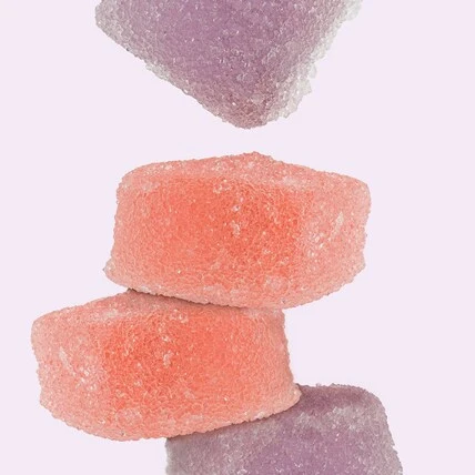 an image of big pete's strawberry watermelon THC gummies on a purple background
