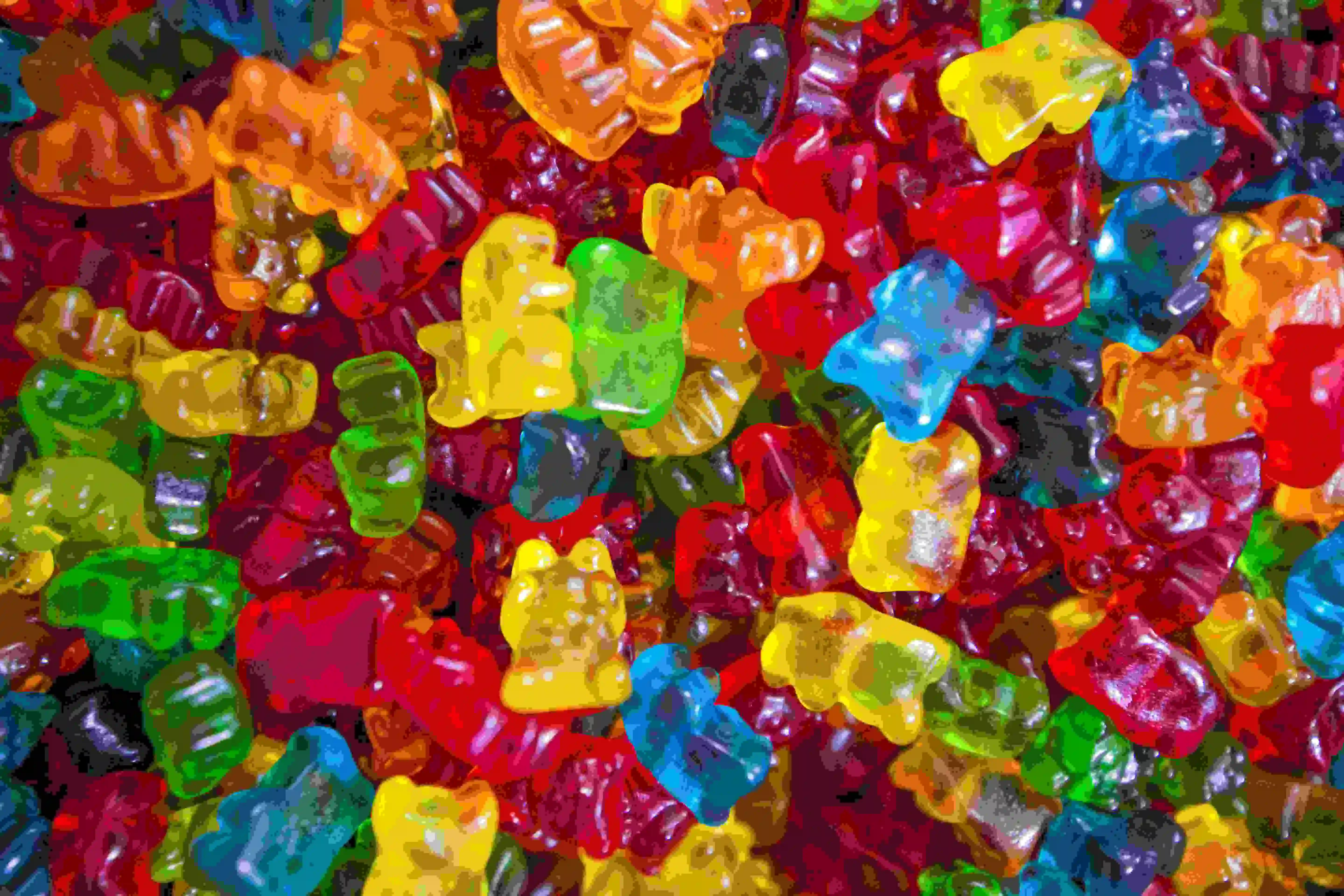 a full screen of multicolored edible thc gummy bears