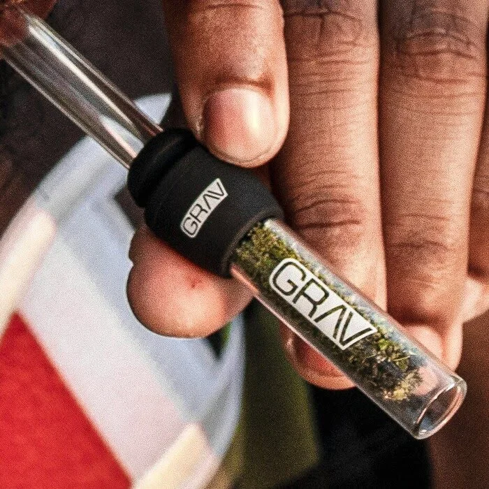 high life glass blunt packed fully in someone's hand