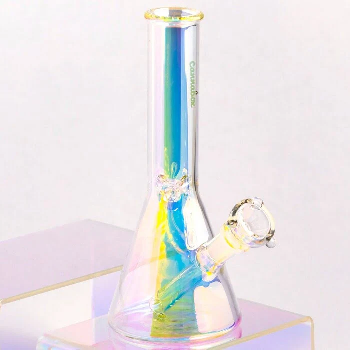 cookies original beaker in rainbow lighting on a set of purple stairs