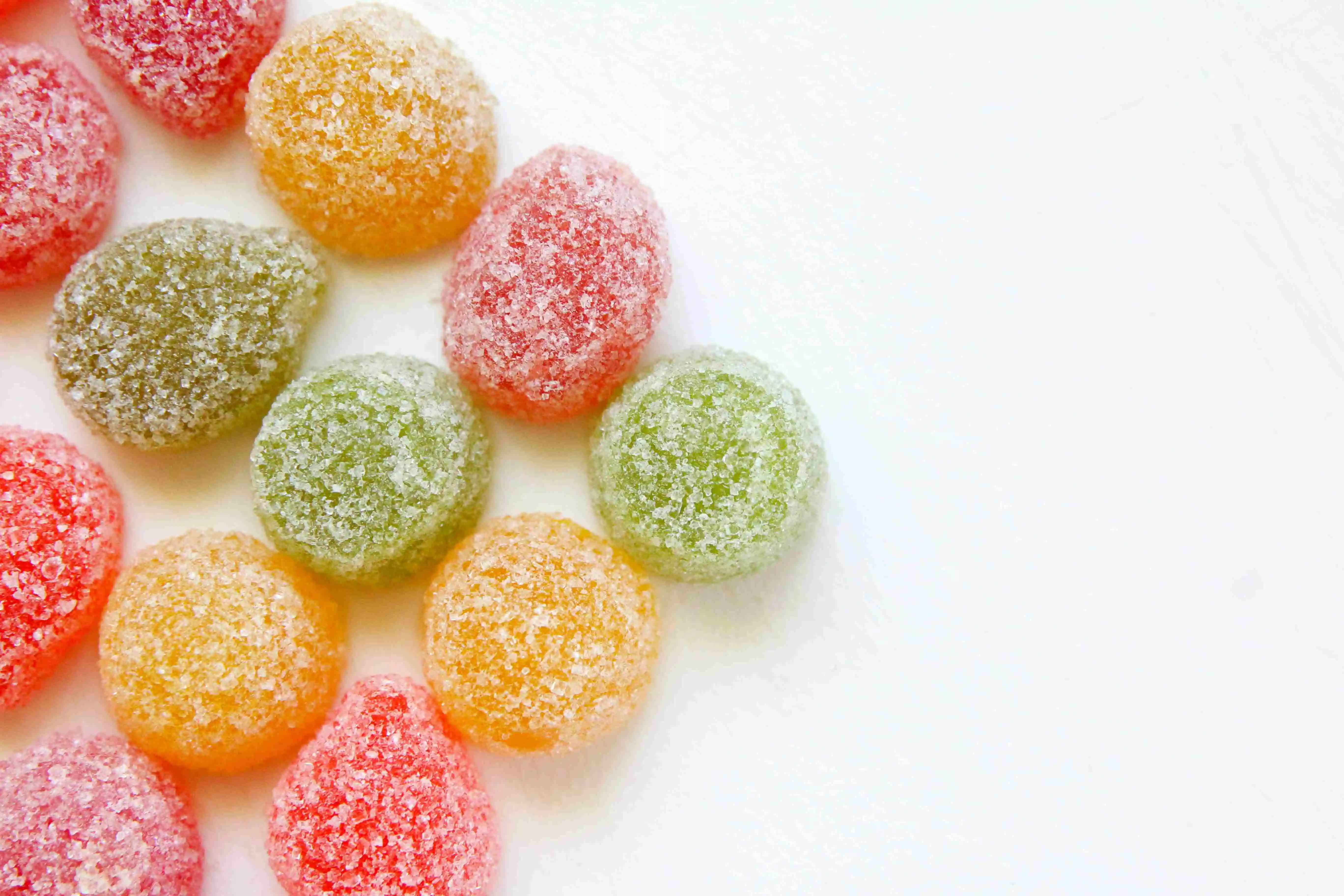 big pete's strawberry watermelon high thc gummies in a triangle shape on a white background