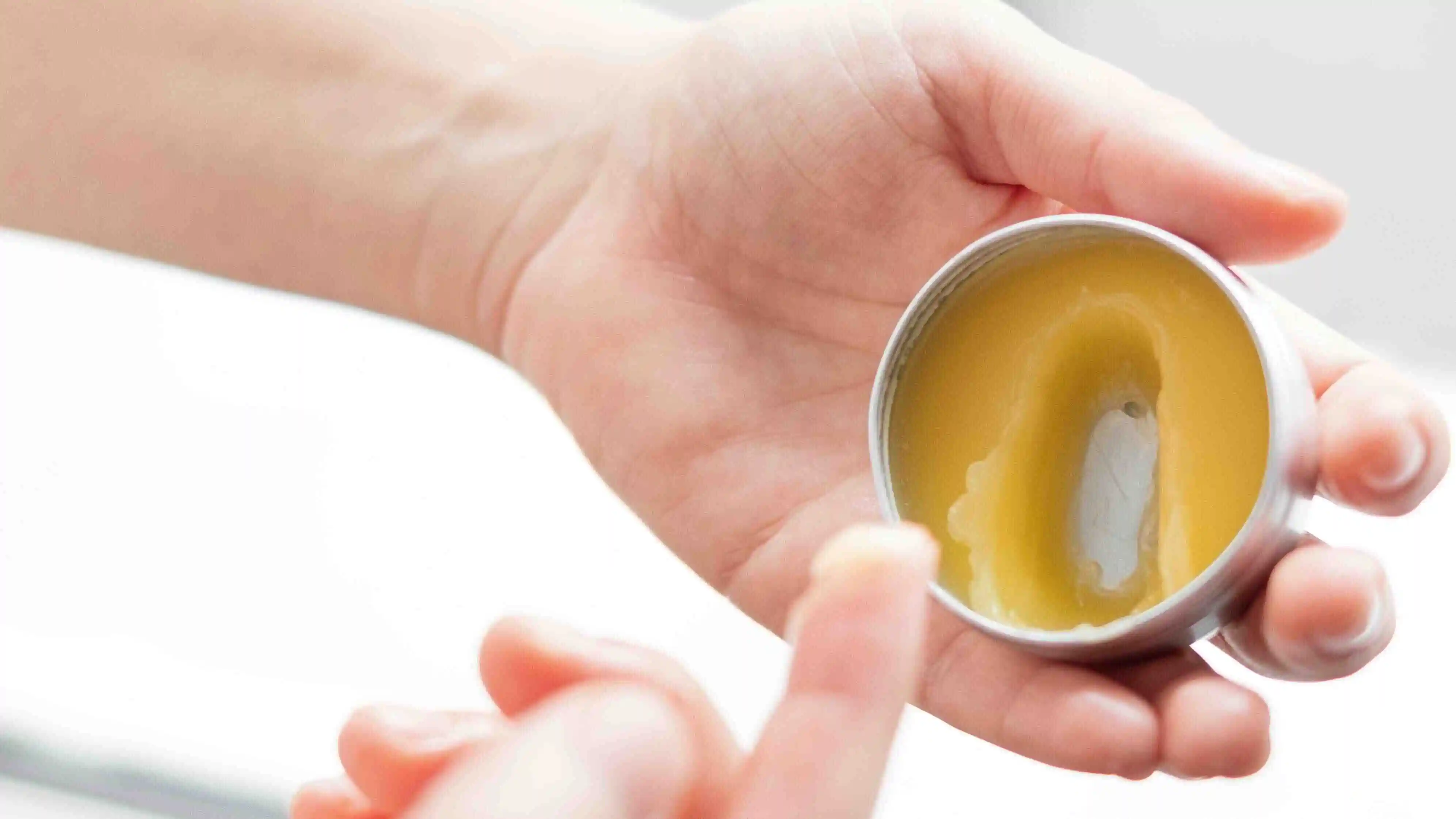 proofly thc body cream being applied to a hand