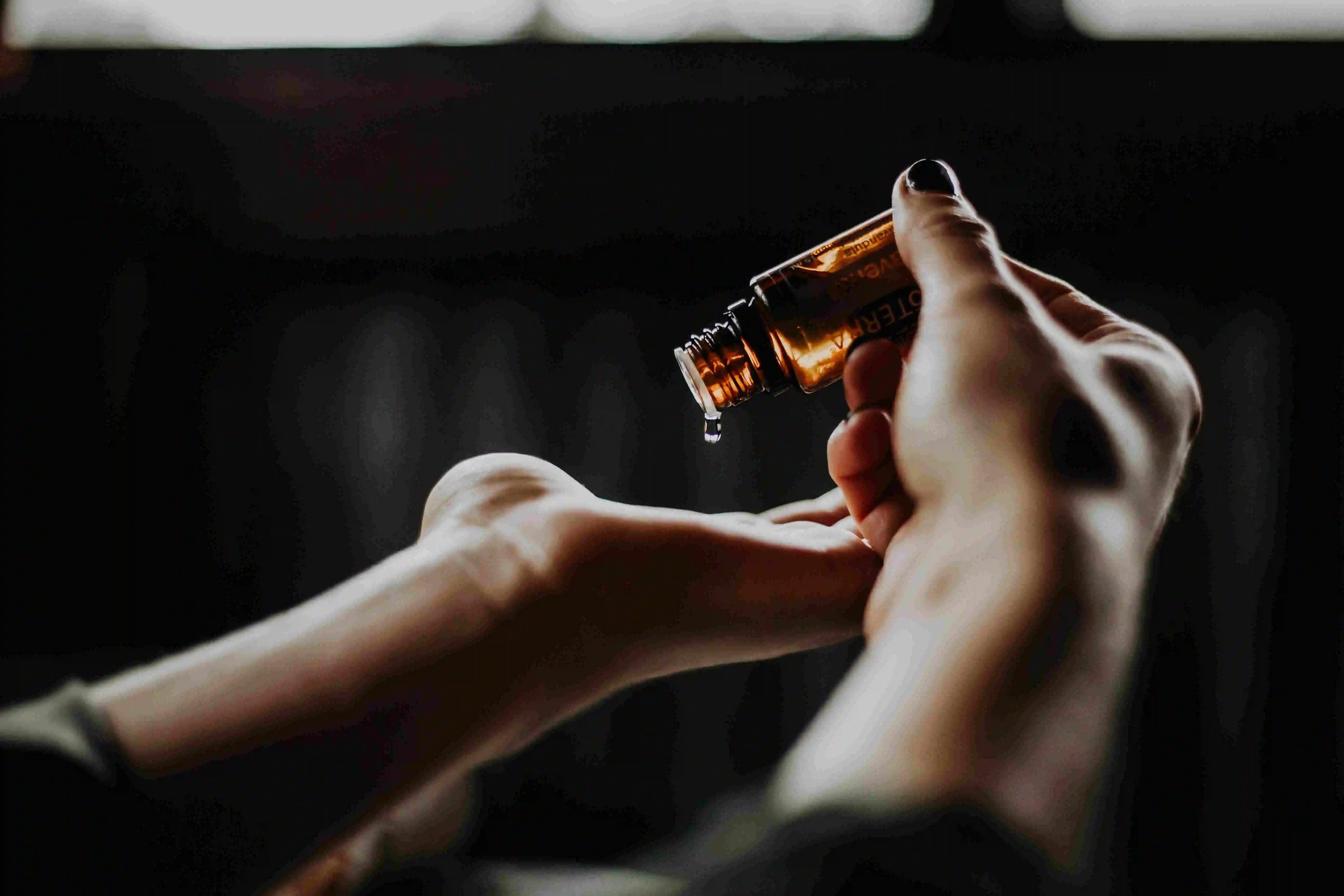 tweed houndstooth thc oil spray being applied to a hand